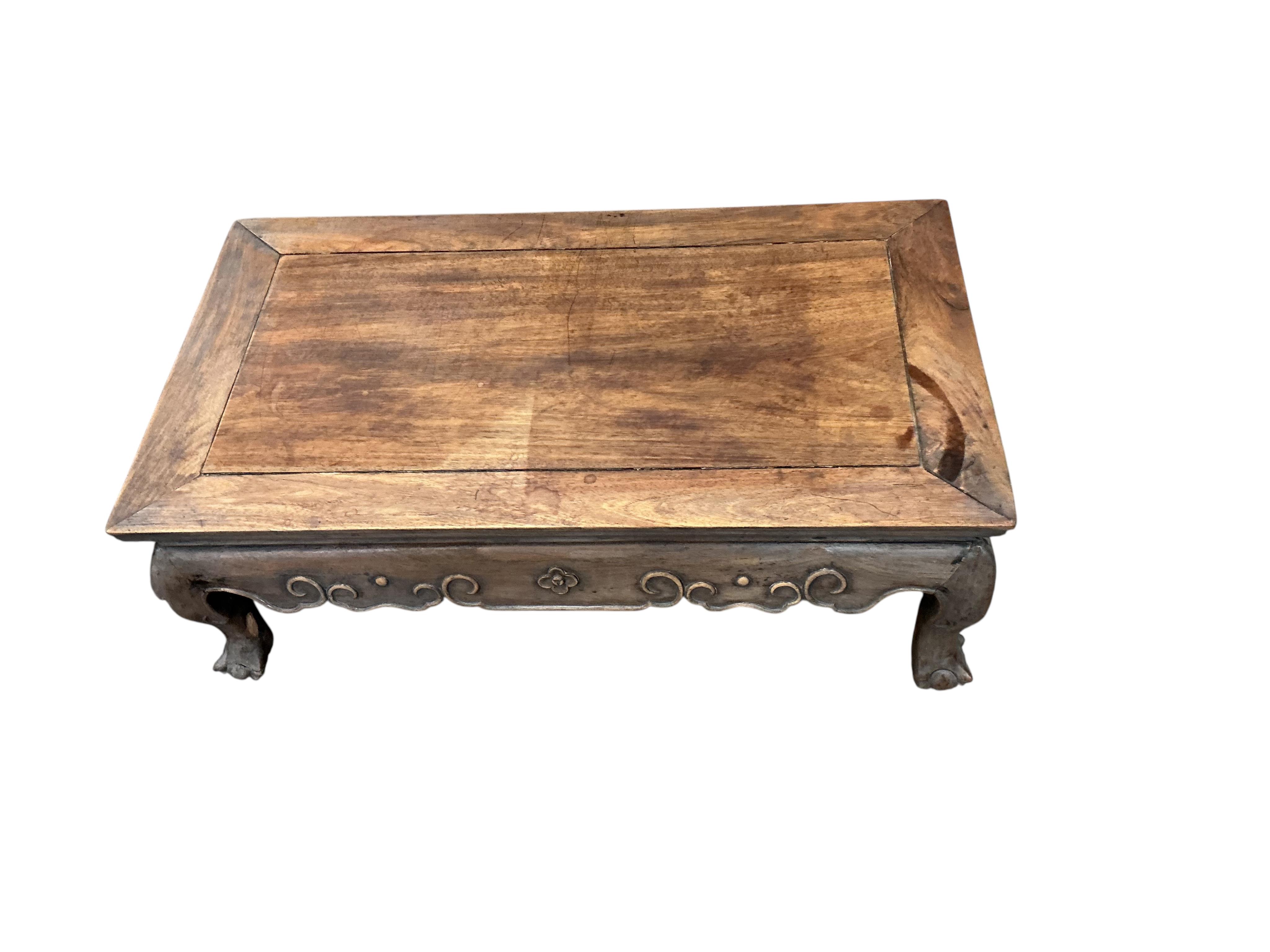A Chinese rectangular hongmu low table, faded, width 77cm, depth 42cm, height 28cm